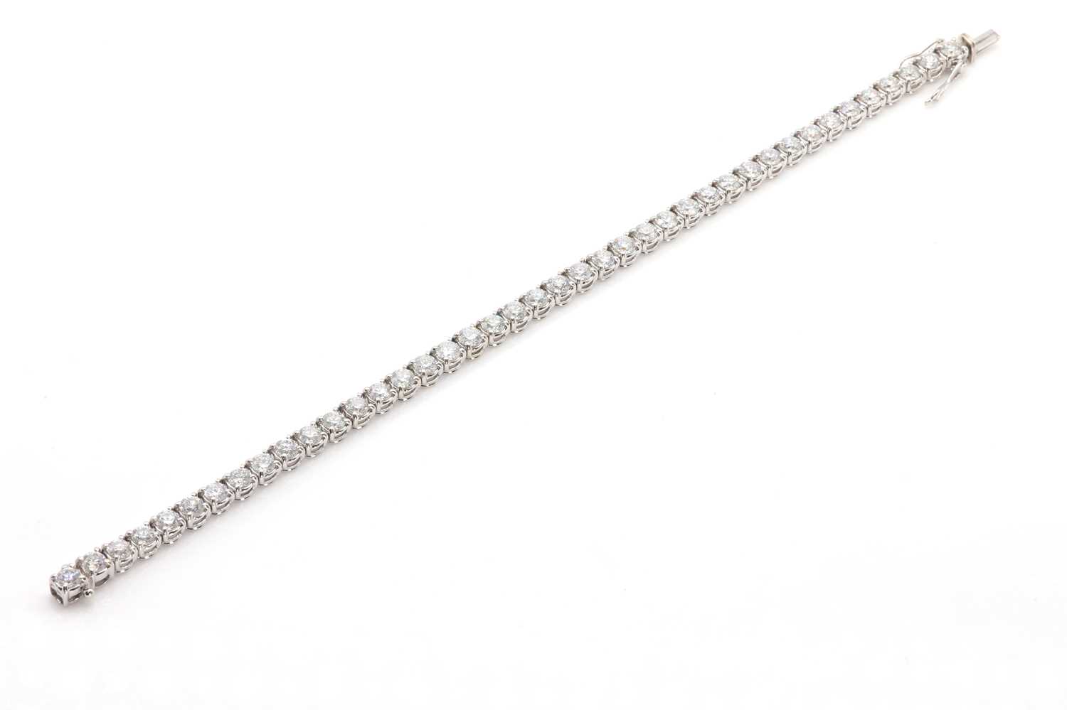 Lot 174 - A diamond line bracelet set in 18ct white gold