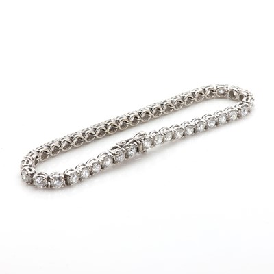 Lot 174 - A diamond line bracelet set in 18ct white gold