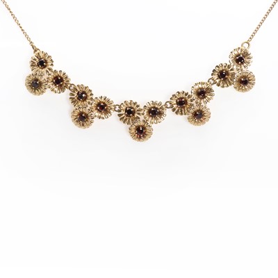 Lot 1117 - A gold garnet floral link necklace