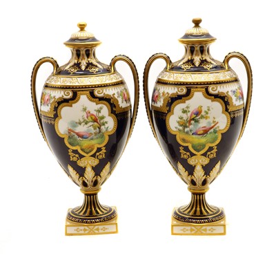 Lot 248 - A pair of Royal Crown Derby twin handled vase and covers