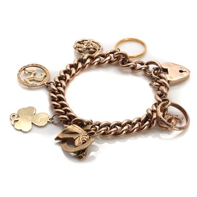 Lot 1416 - A gold charm bracelet