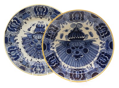 Lot 115 - A Dutch Delft blue and white charger and bowl