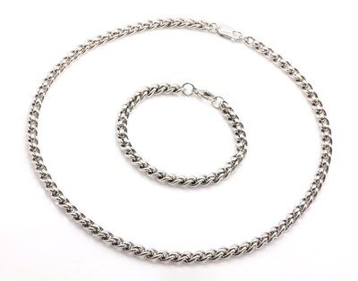 Lot 215 - A 9ct white gold bracelet and chain set