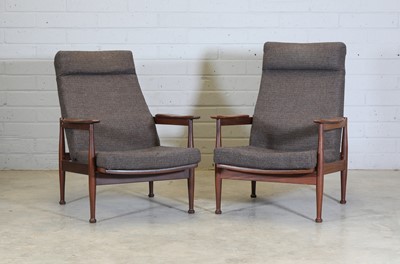 Lot 428 - A pair of 'Manhattan' afrormosia lounge armchairs