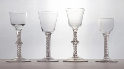 Lot 142 - A group of four 18th century opaque twist wine glasses