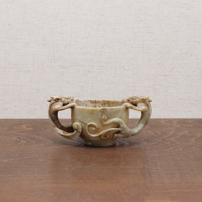 Lot 221 - A Chinese jade two-handled cup