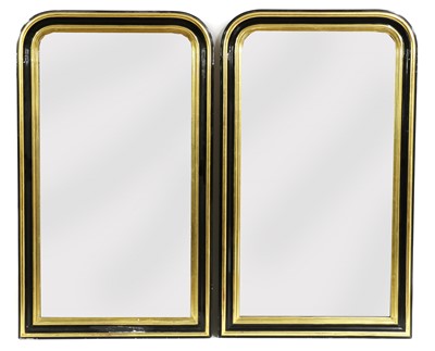 Lot 481 - A pair of gilt and ebonised wall mirrors