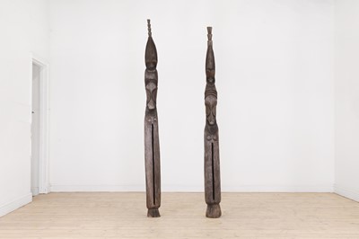 Lot 455 - A near pair of carved wooden 'Atingting kon' slit gongs