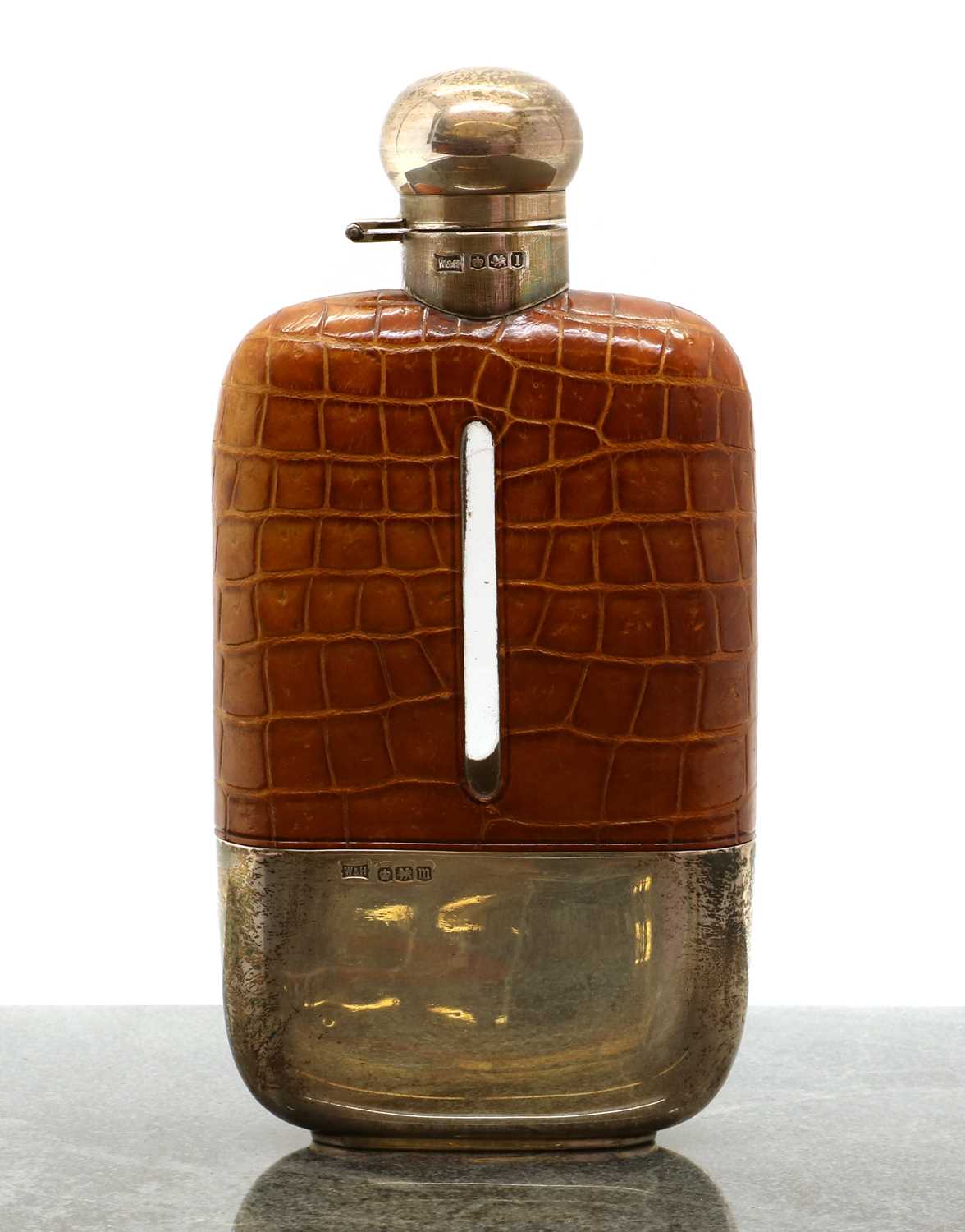 Lot 32 A silver, leather and glass hip flask