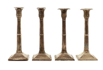 Lot 67 - A matched set of four Victorian silver candlesticks