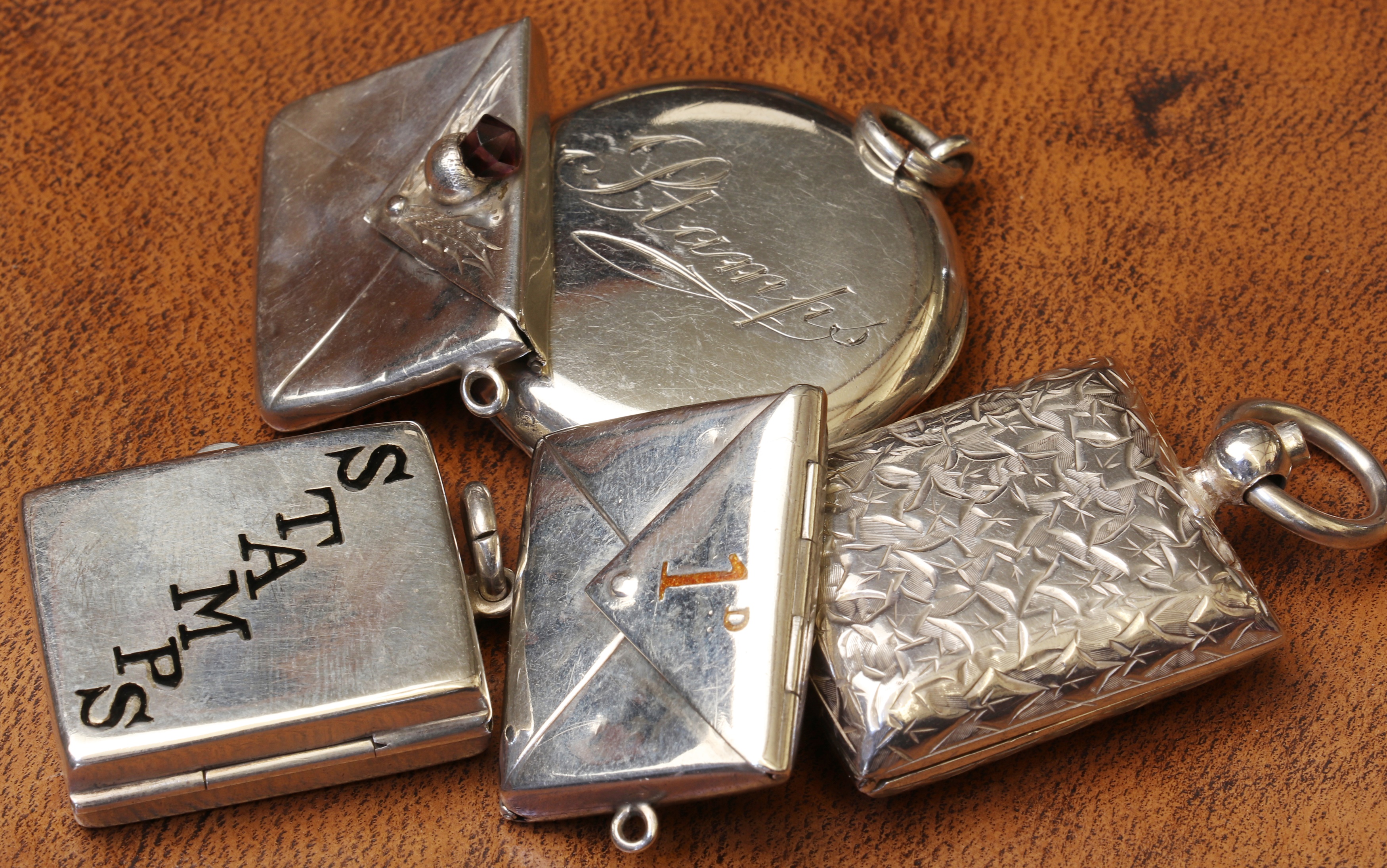 Lot 88 A group of five silver stamp cases