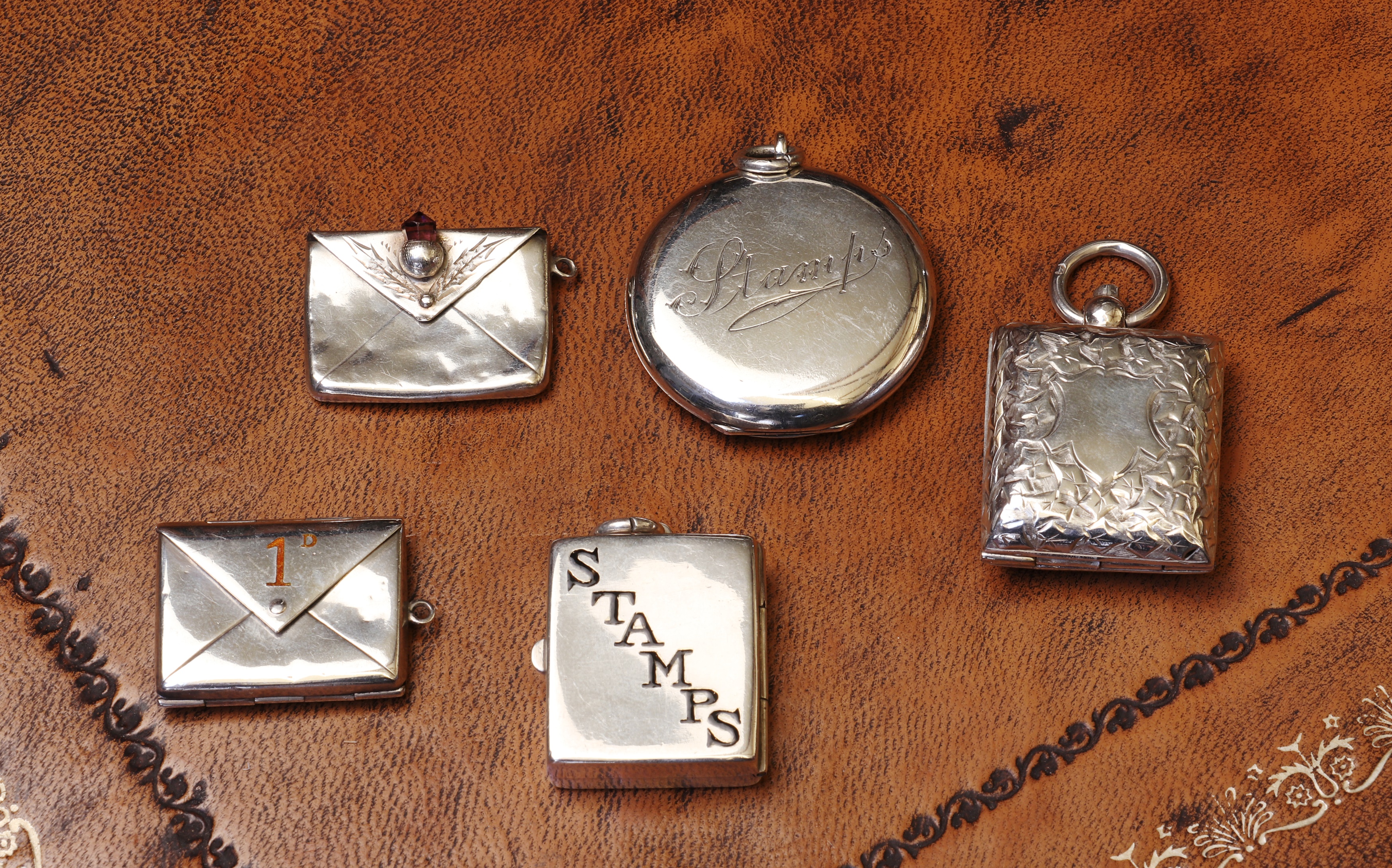 Lot 88 A group of five silver stamp cases