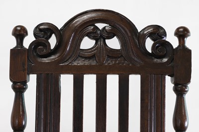 Lot 239 - A Carolean oak elbow chair