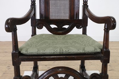 Lot 239 - A Carolean oak elbow chair