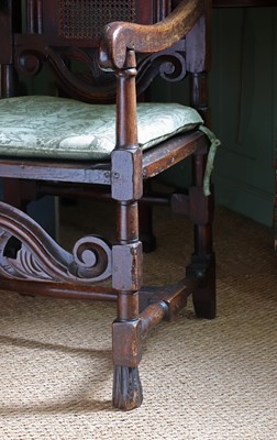 Lot 239 - A Carolean oak elbow chair