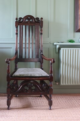 Lot 239 - A Carolean oak elbow chair