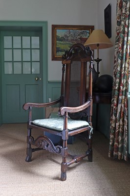 Lot 239 - A Carolean oak elbow chair