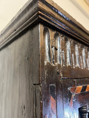 Lot 345 - A Charles I oak and inlaid ventilated livery cupboard