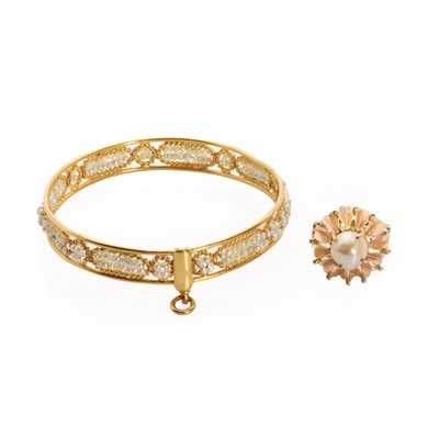 Lot 1224 - A high carat gold wire seed pearl bangle