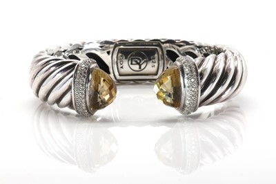 Lot 217 - A sterling silver diamond and citrine set hinged torque bangle, by David Yurman