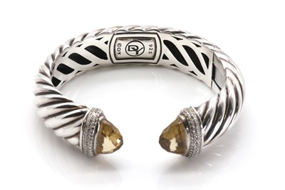 Lot 217 - A sterling silver diamond and citrine set hinged torque bangle, by David Yurman