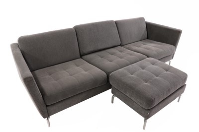 Lot 607 - A BoConcept grey upholstered sofa and footstool