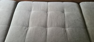 Lot 607 - A BoConcept grey upholstered sofa and footstool