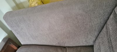Lot 607 - A BoConcept grey upholstered sofa and footstool