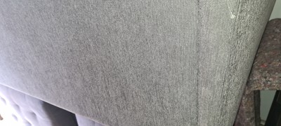 Lot 607 - A BoConcept grey upholstered sofa and footstool