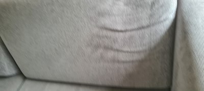 Lot 607 - A BoConcept grey upholstered sofa and footstool