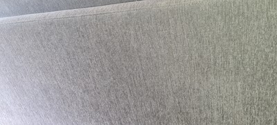 Lot 607 - A BoConcept grey upholstered sofa and footstool