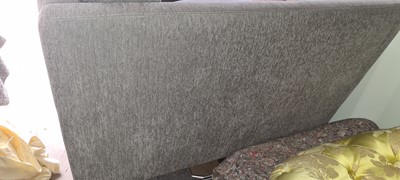 Lot 607 - A BoConcept grey upholstered sofa and footstool