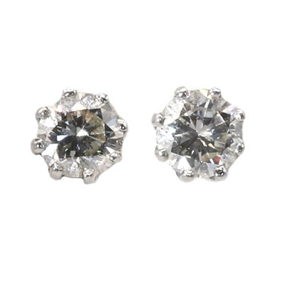 Lot 219 - A pair of white gold diamond stud earrings