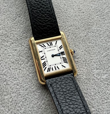 Lot 313 - A ladies' gold and stainless steel Cartier Tank Solo quartz strap watch