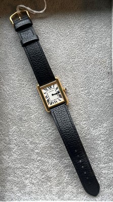 Lot 313 - A ladies' gold and stainless steel Cartier Tank Solo quartz strap watch