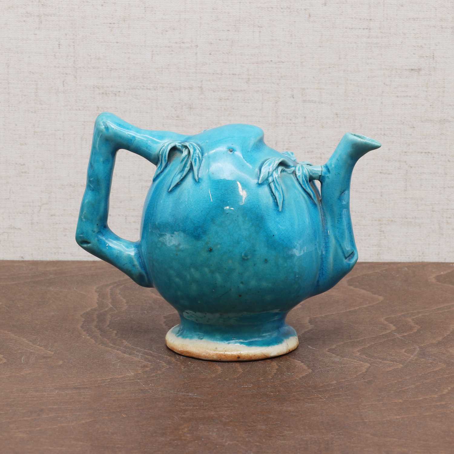 Lot 126 - A Chinese turquoise-glazed teapot