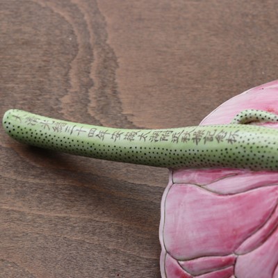 Lot 124 - A Chinese famille rose lotus cup