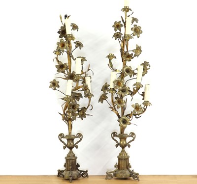 Lot 389 - A pair of gilt metal candelabra