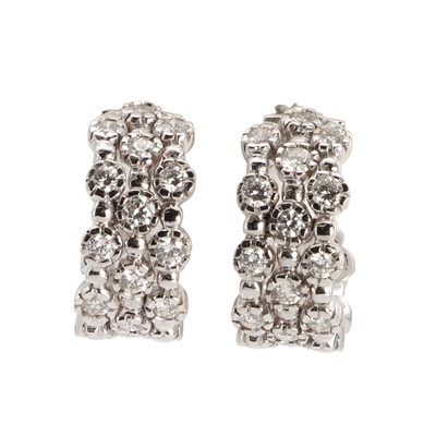 Lot 1077 - A pair of diamond set white gold hoop earrings