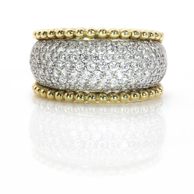 Lot 227 - An18ct two colour gold diamond bombé ring