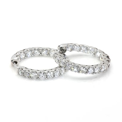 Lot 97 - A pair of white gold 'inside-out' diamond hoop earrings