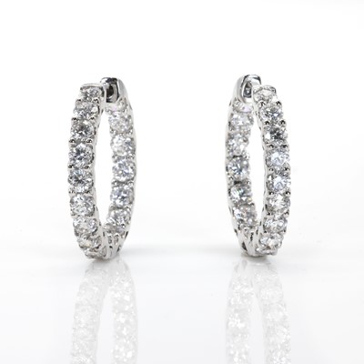 Lot 97 - A pair of white gold 'inside-out' diamond hoop earrings