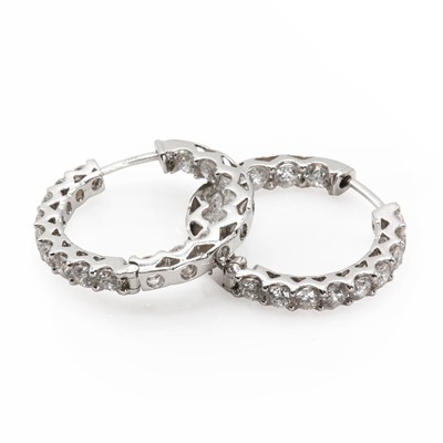 Lot 97 - A pair of white gold 'inside-out' diamond hoop earrings