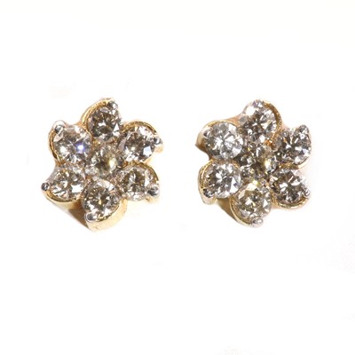 Lot 220 - A pair of gold diamond set daisy cluster stud earrings