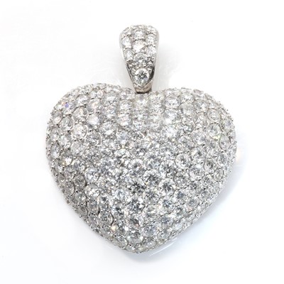 Lot 173 - A white gold and diamond bombé heart pendant