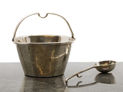 Lot 14 - A silver cream pail and spoon