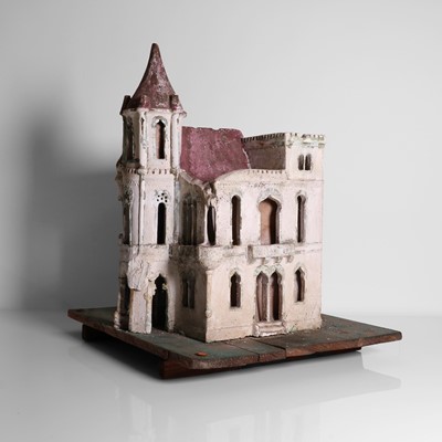 Lot 267 - A folk art plaster model of a house