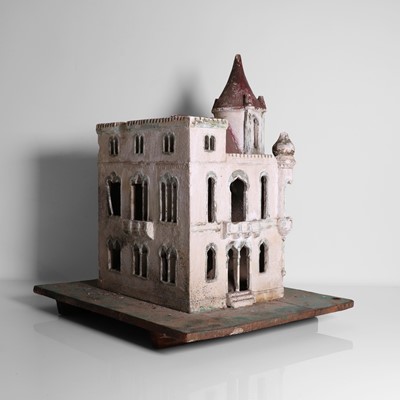 Lot 267 - A folk art plaster model of a house