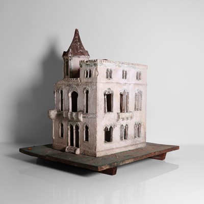 Lot 267 - A folk art plaster model of a house