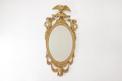 Lot 229 - A giltwood oval wall mirror